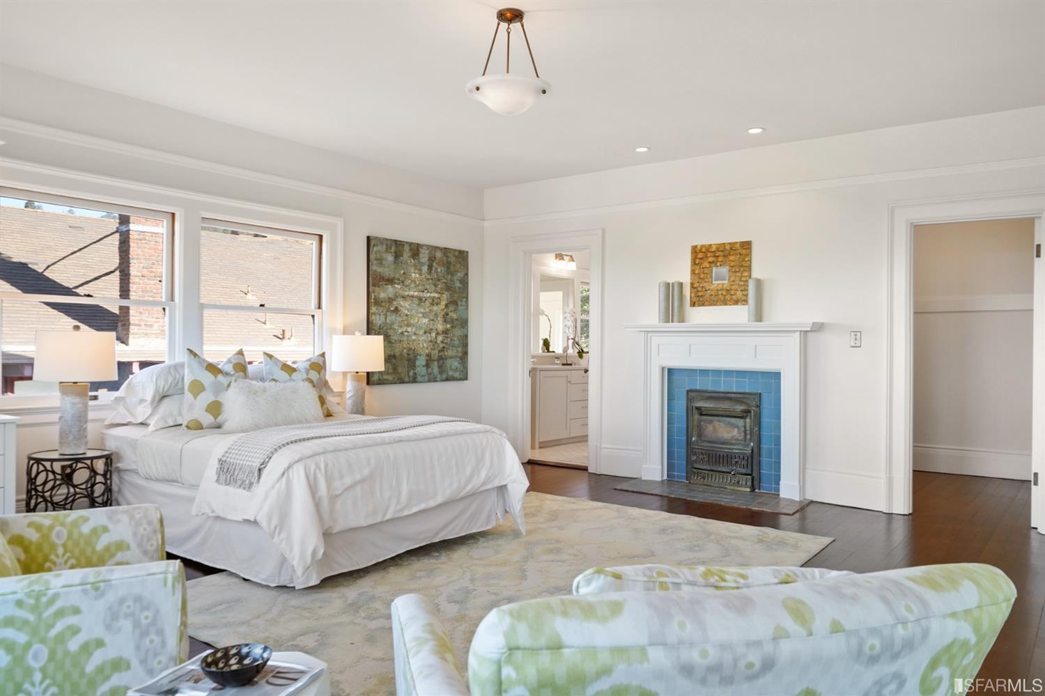 1314 Arch Street Berkeley, CA 94708 - Photo 40 of 90 a spacious bedroom with a bed and a fireplace