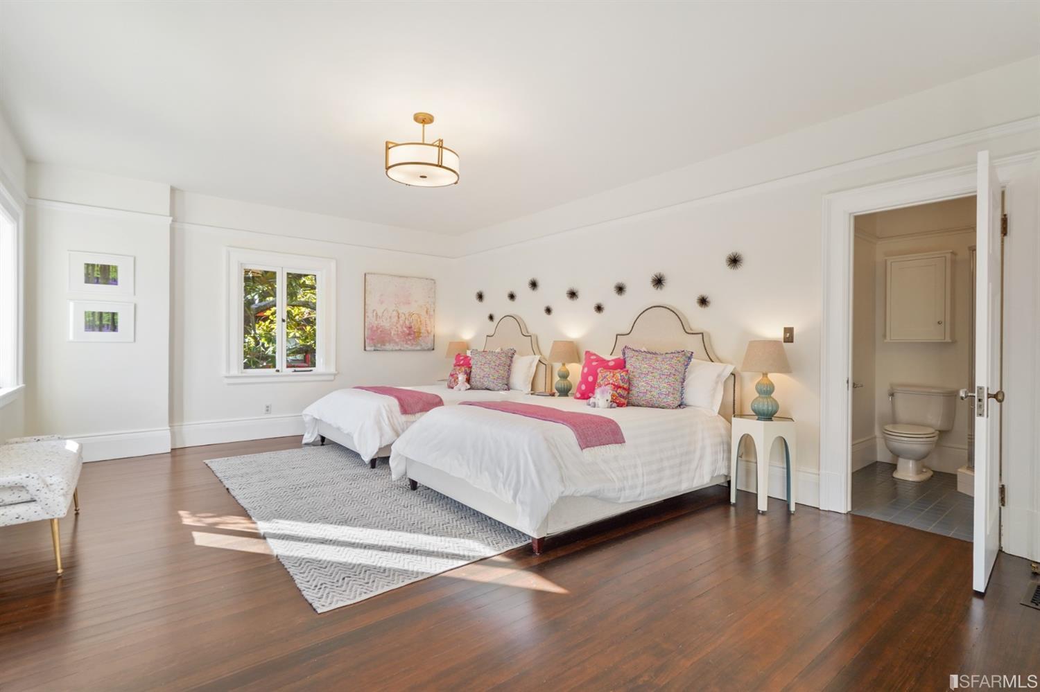 1314 Arch Street Berkeley, CA 94708 - Photo 41 of 90 a bedroom with a bed and wooden floor