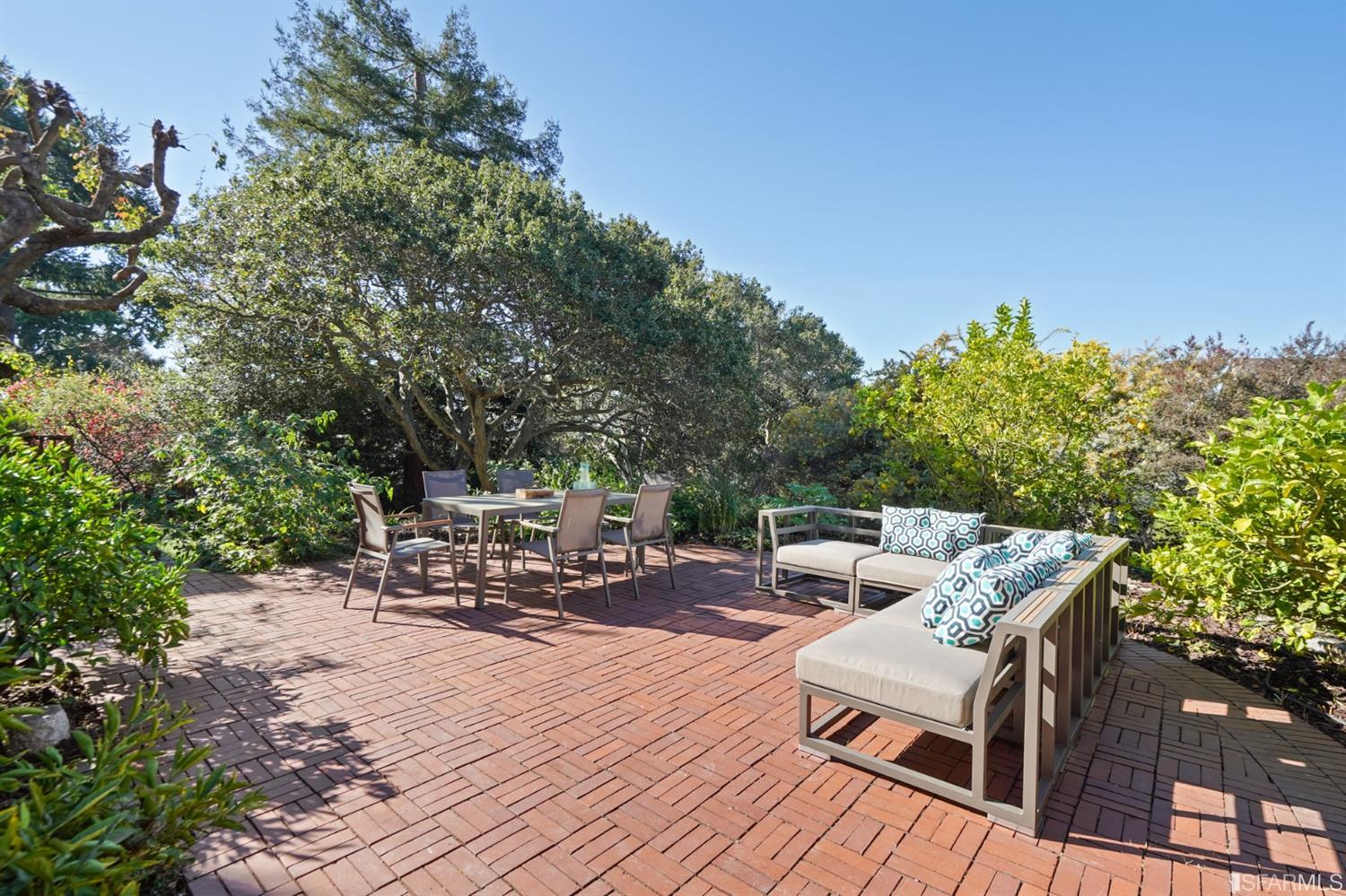 1314 Arch Street Berkeley, CA 94708 - Photo 60 of 90 a backyard of a house with table and chairs