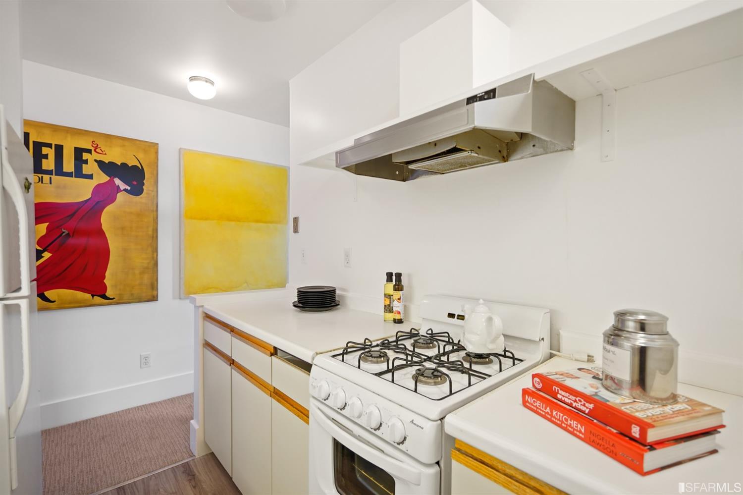 1314 Arch Street Berkeley, CA 94708 - Photo 72 of 90 a kitchen with a stove and a white refrigerator