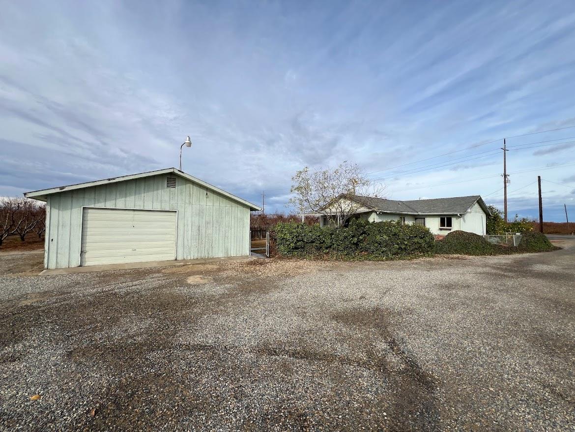 16109 East Manning Reedley, CA 93654 - Photo 29 of 30 a view of a house with backyard and garage