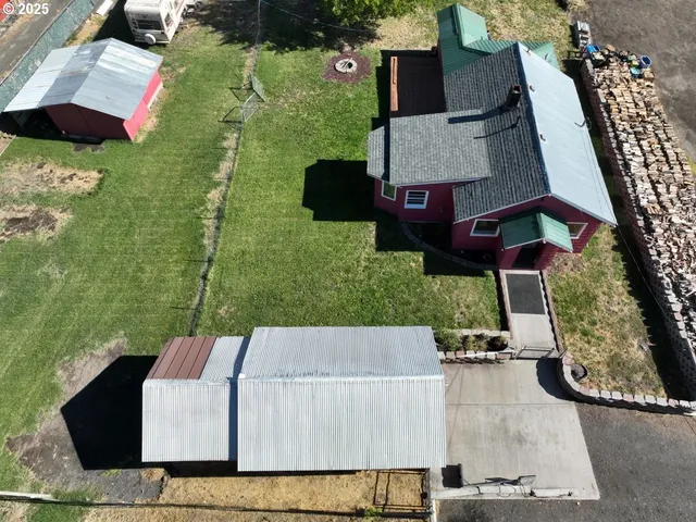 an aerial view of a house having yard