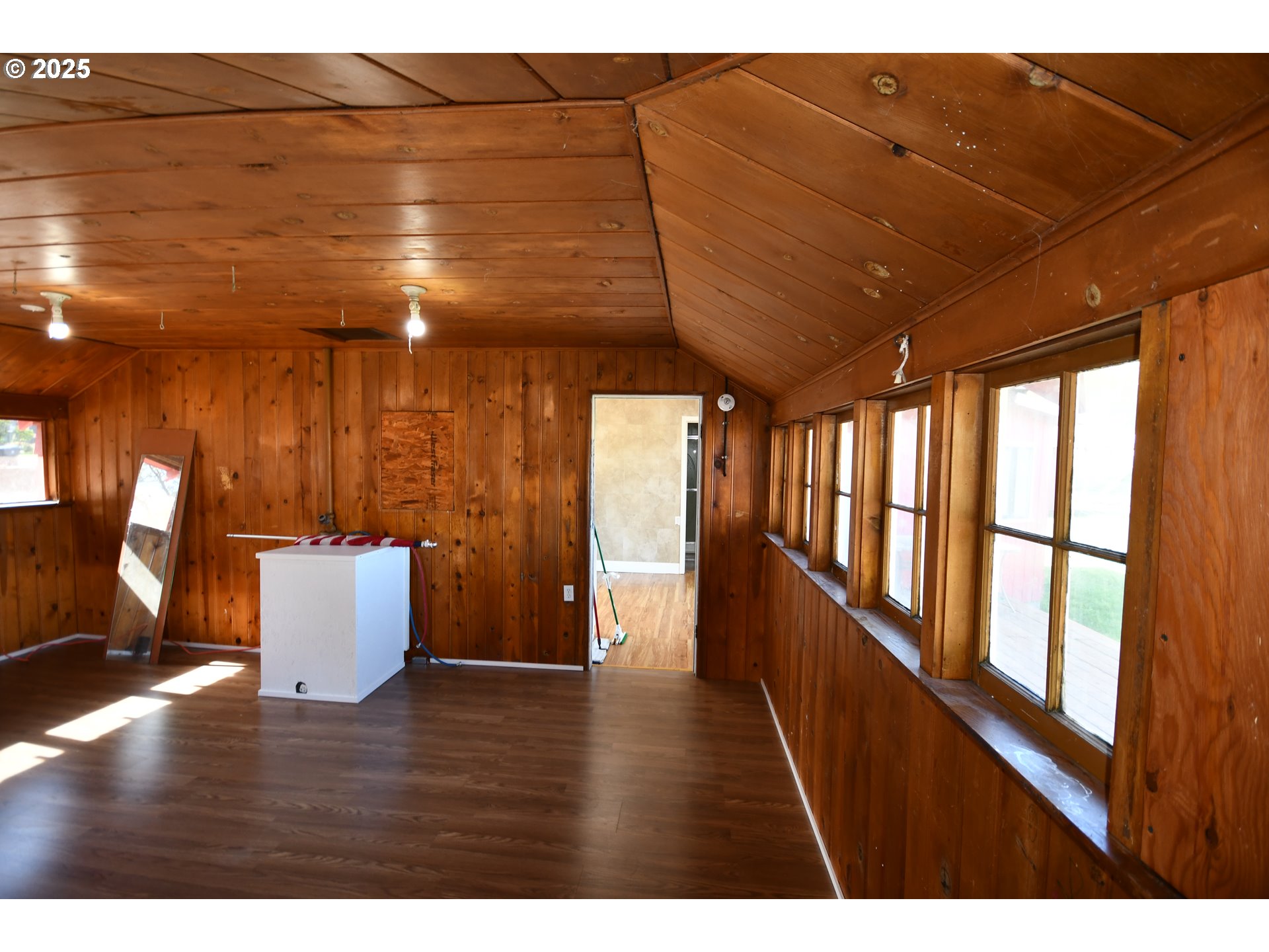 2829 West 9th Street The Dalles, OR 97058 - Photo 21 of 45 a view of an empty room with wooden floor