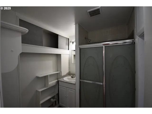 a kitchen with a refrigerator and a microwave
