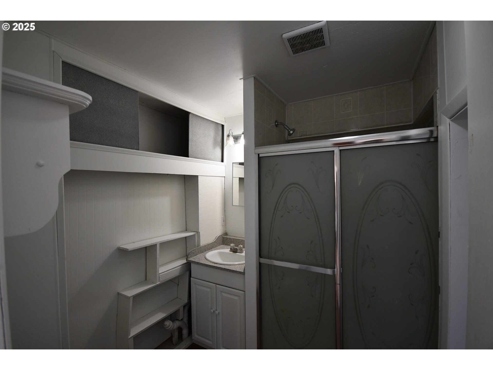 2829 West 9th Street The Dalles, OR 97058 - Photo 23 of 45 a kitchen with a refrigerator and a microwave