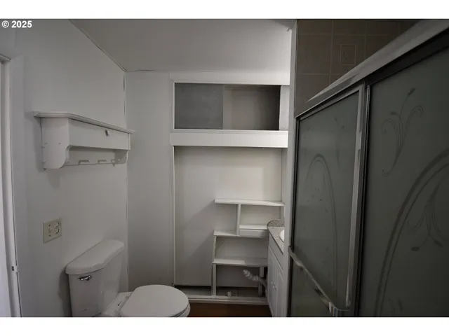 a kitchen with a refrigerator and a sink