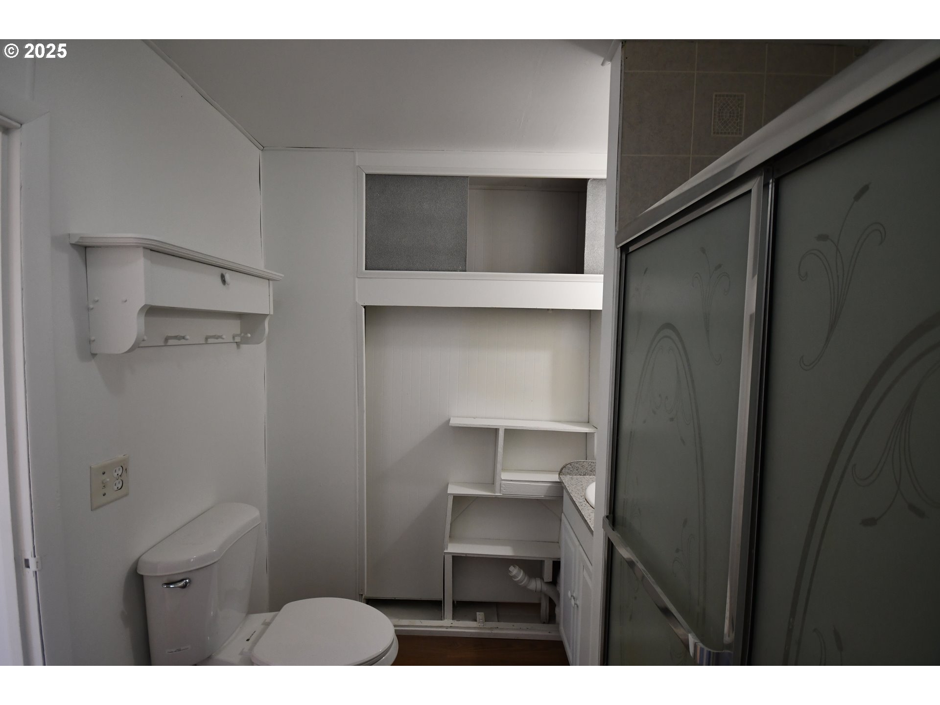 2829 West 9th Street The Dalles, OR 97058 - Photo 24 of 45 a kitchen with a refrigerator and a sink