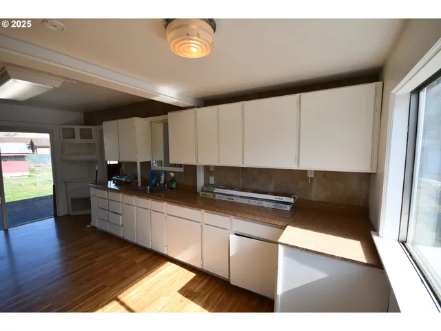 a kitchen with a sink and cabinets