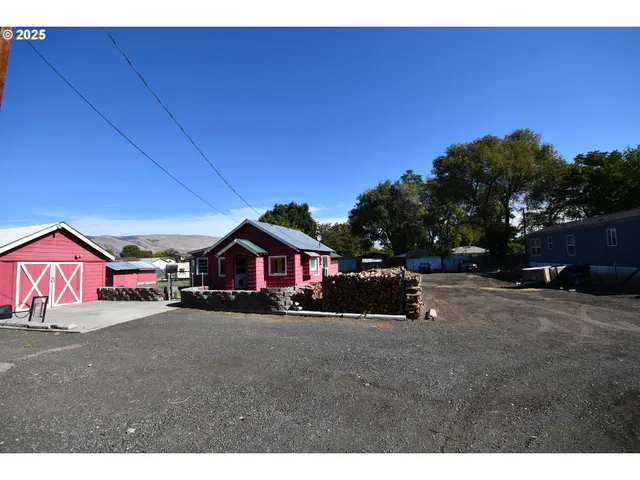 a view of living room with furniture and wooden floor
