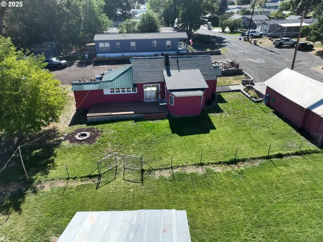 an aerial view of a garden with lawn chairs