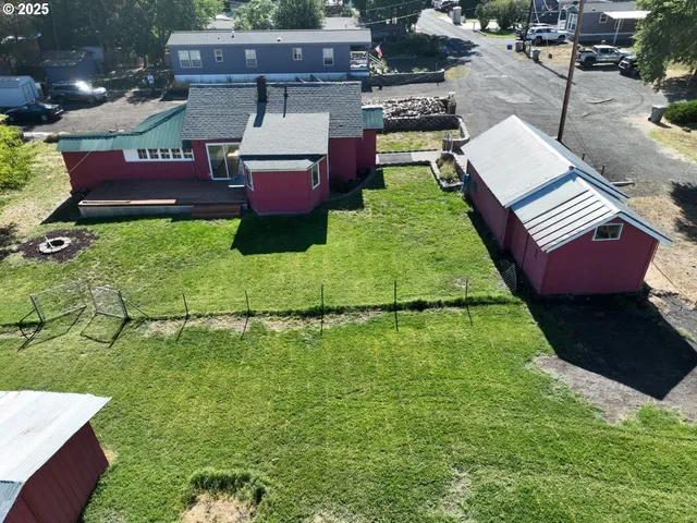 a aerial view of a house with a yard