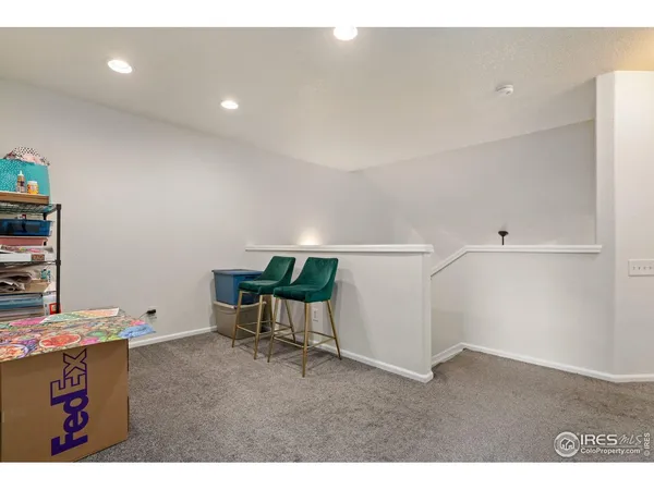 a room with furniture and white walls