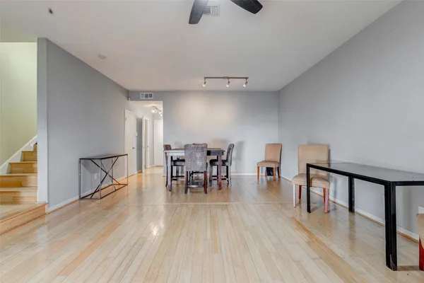 a view of a dining room with furniture and wooden floor