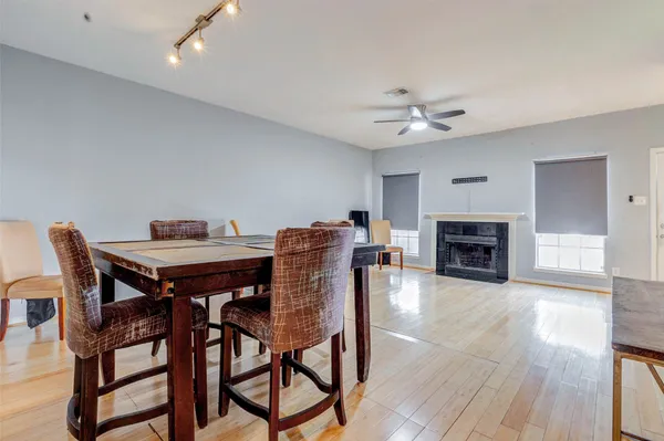 a view of a dining room with furniture and a fireplace