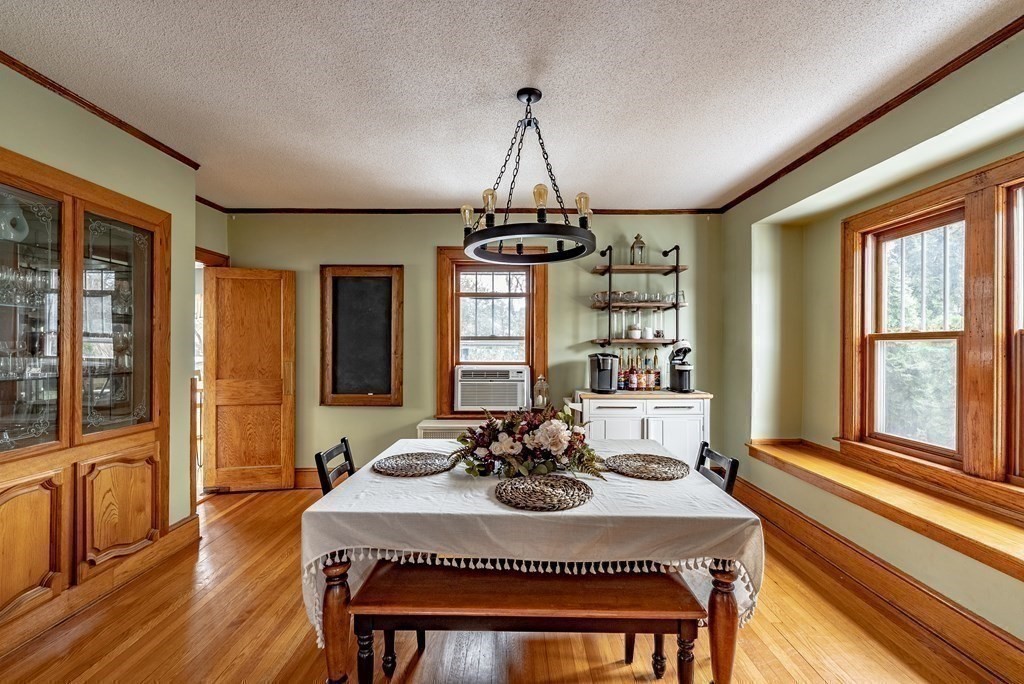 24 Manchester Terrace Springfield, MA 01108 - Photo 11 of 38 a view of a dining room with furniture window and wooden floor