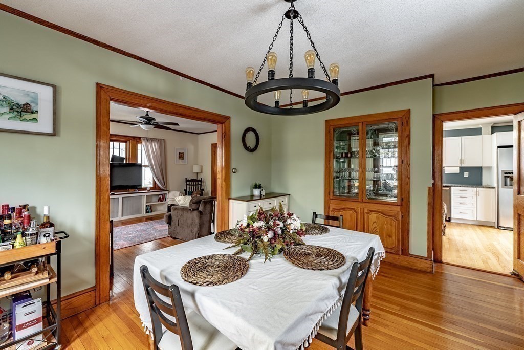 24 Manchester Terrace Springfield, MA 01108 - Photo 13 of 38 a view of a dining room with furniture wooden floor and chandelier