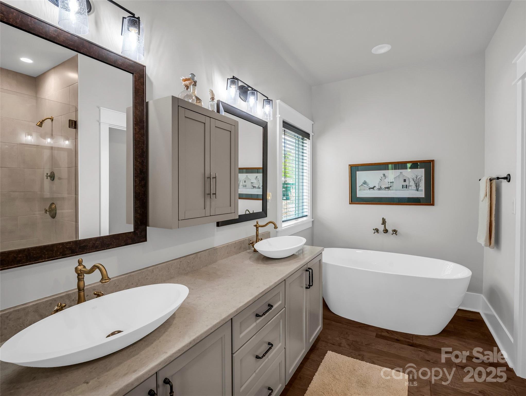 87 Jackson Ridge Ln Mill Spring Mill Spring, NC 28756 - Photo 18 of 42 a bathroom with a double vanity sink mirror and bathtub