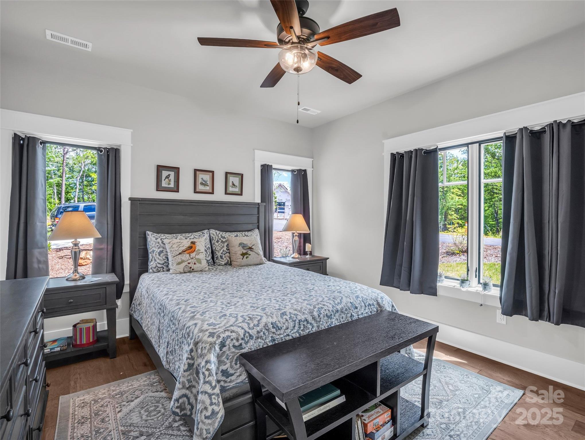 87 Jackson Ridge Ln Mill Spring Mill Spring, NC 28756 - Photo 20 of 42 a bedroom with a bed a dresser and window