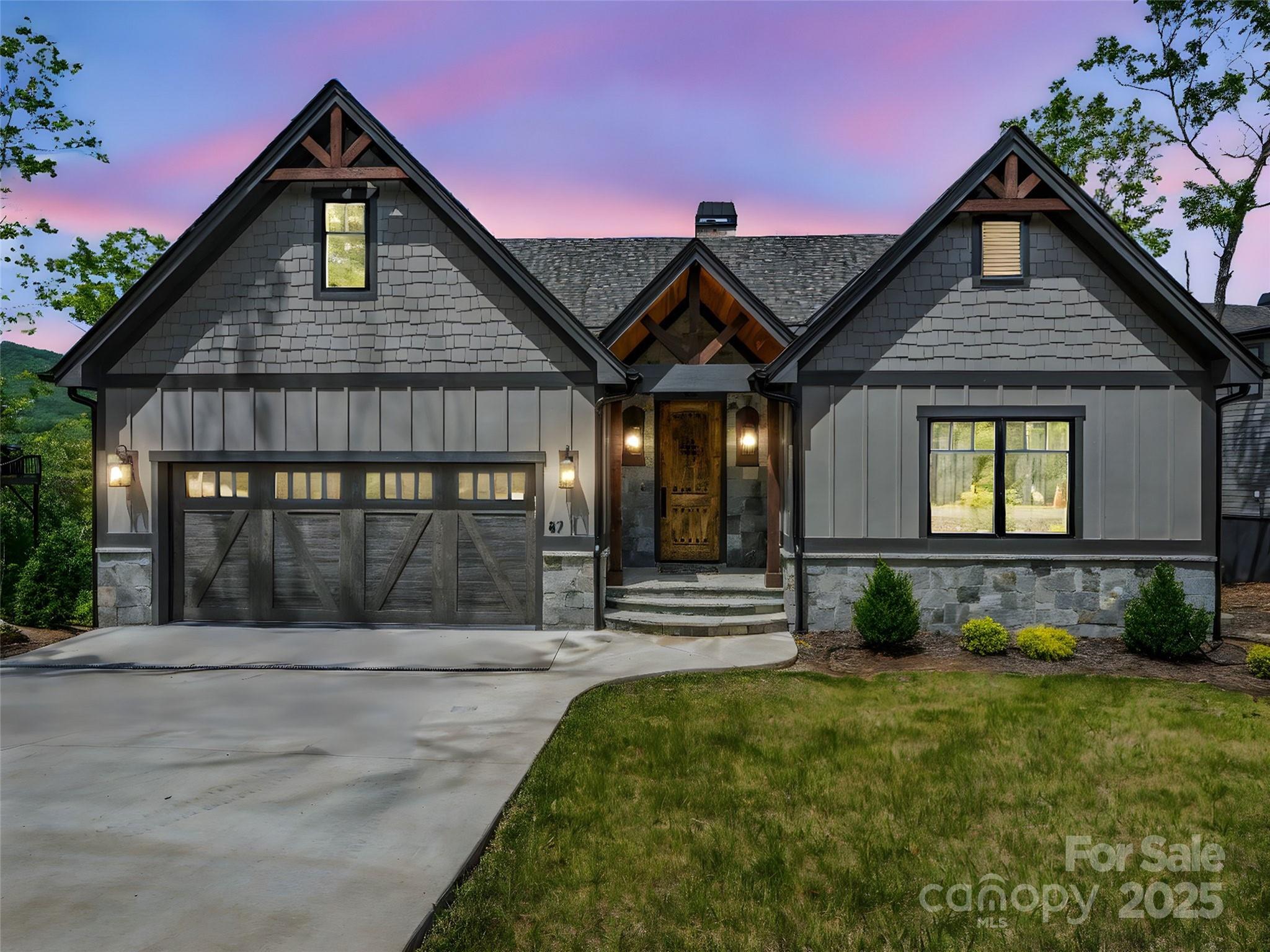 87 Jackson Ridge Ln Mill Spring Mill Spring, NC 28756 - Photo 2 of 42 a front view of a house with a yard