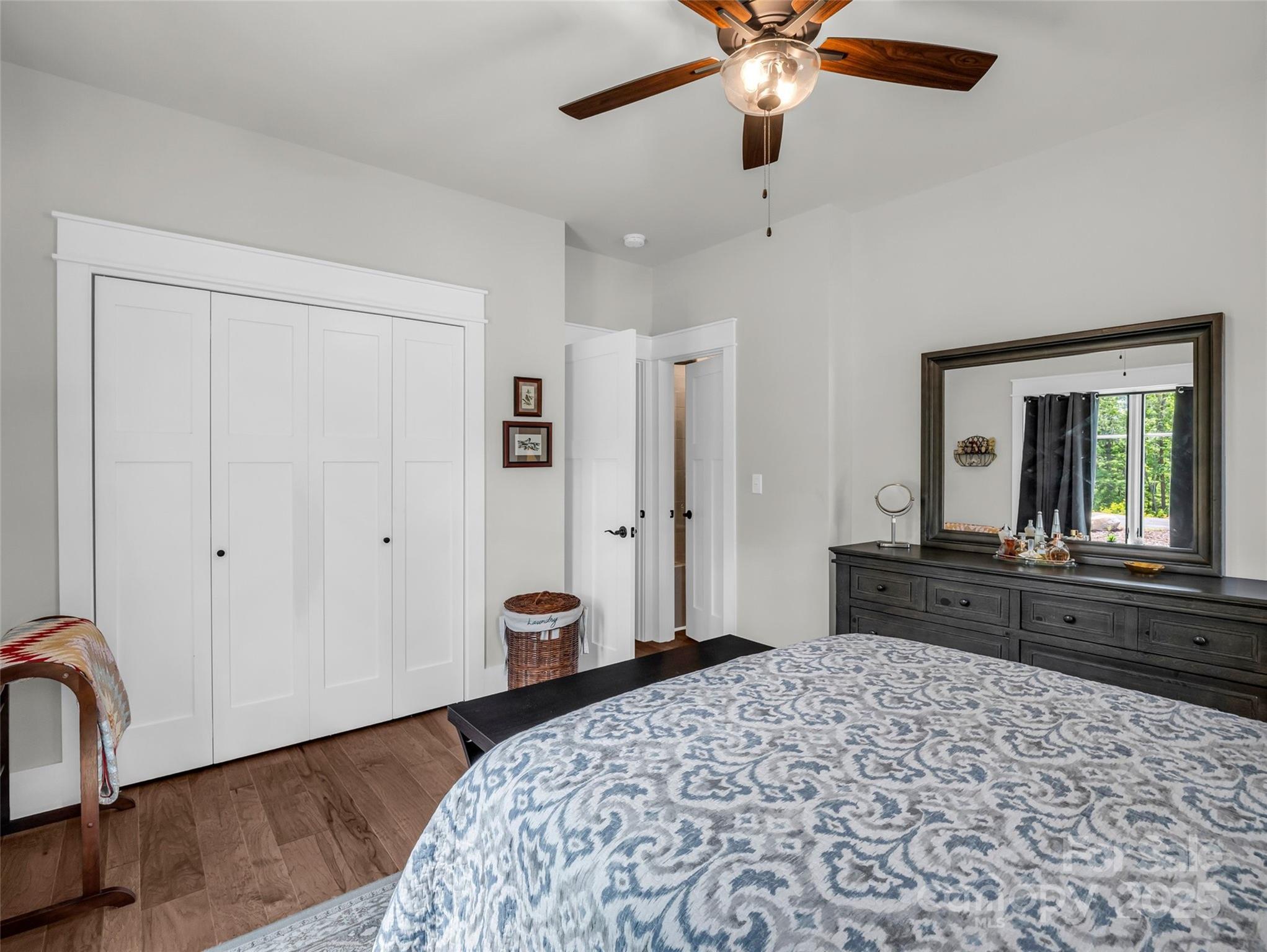 87 Jackson Ridge Ln Mill Spring Mill Spring, NC 28756 - Photo 21 of 42 a bedroom with a bed and a dresser