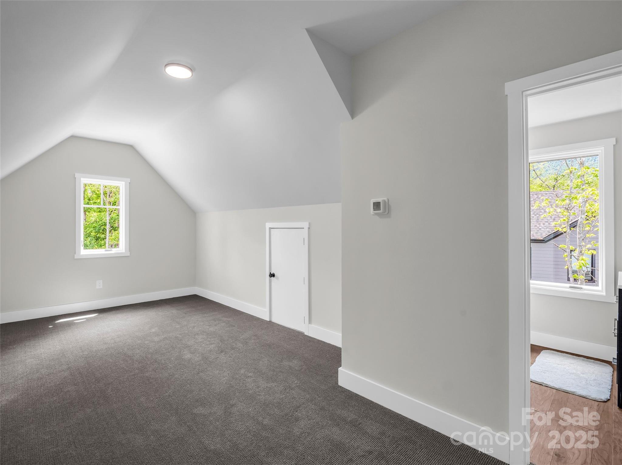 87 Jackson Ridge Ln Mill Spring Mill Spring, NC 28756 - Photo 26 of 42 an empty room with windows and entrance