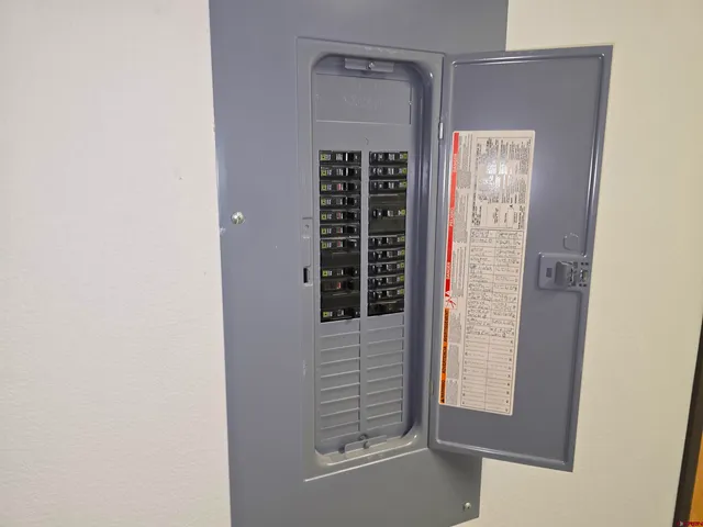 an empty room with windows and entrance