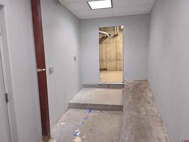 a kitchen with stainless steel appliances granite countertop a refrigerator and a stove