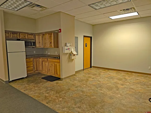 a view of a brick building with many windows