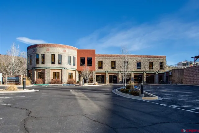 an aerial view of residential houses and outdoor space