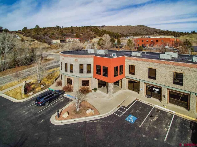 a view of a city with lawn chairs