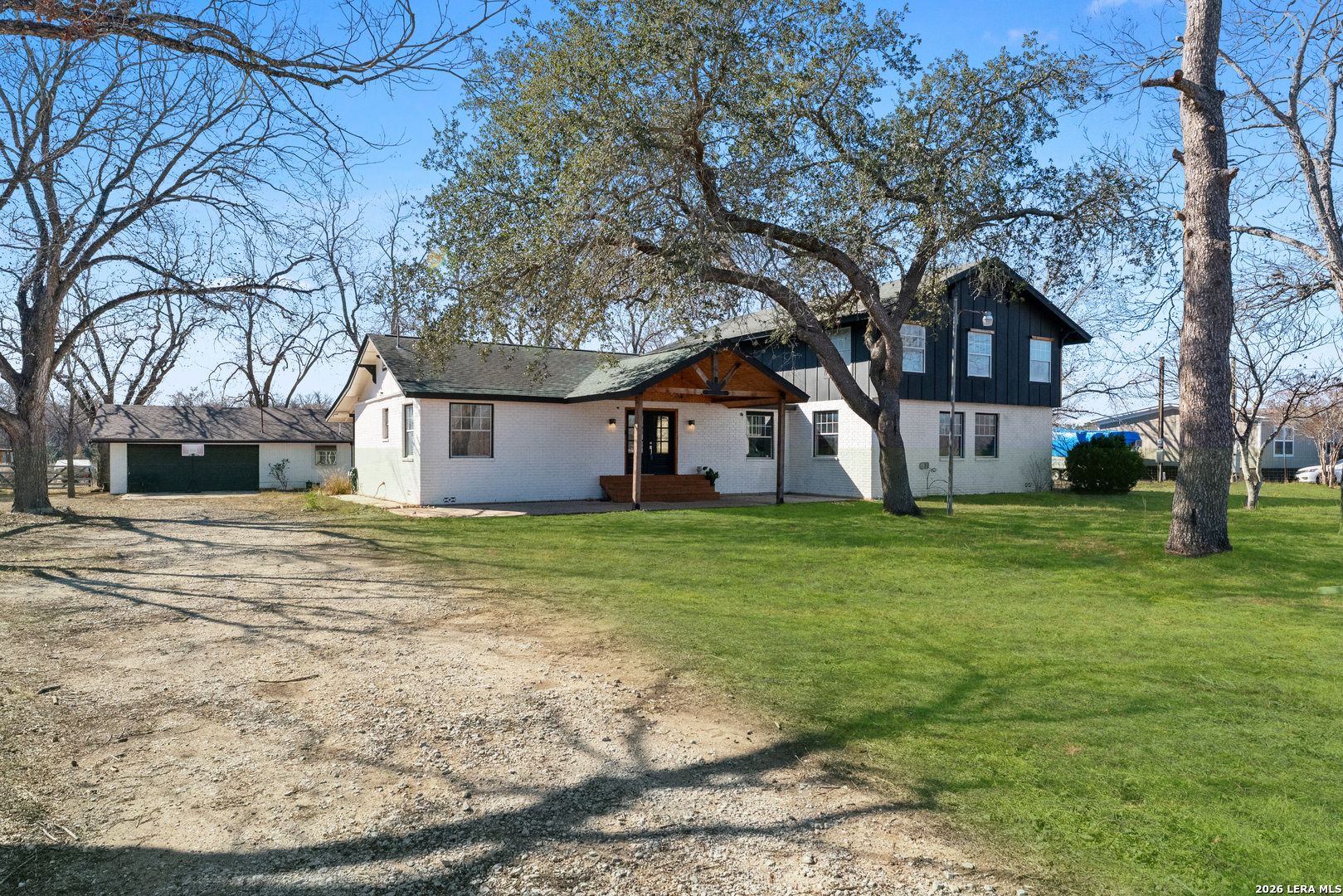 a view of a house with a yard
