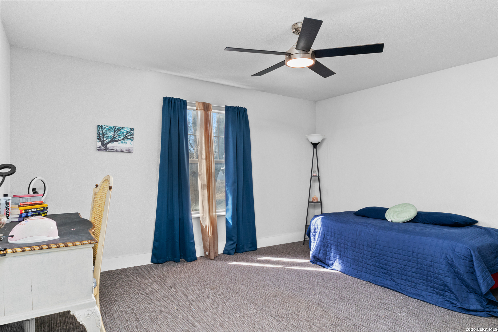 15285 South Skaggs Road Atascosa, TX 78002 - Photo 17 of 36 a bedroom with a bed and a dresser