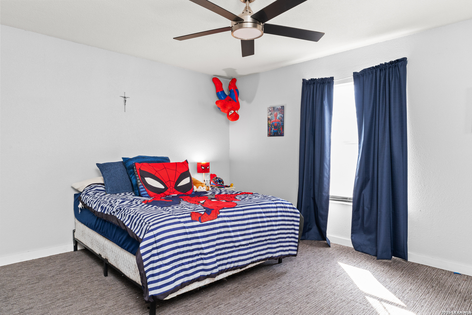 15285 South Skaggs Road Atascosa, TX 78002 - Photo 26 of 36 a bedroom with a bed and window