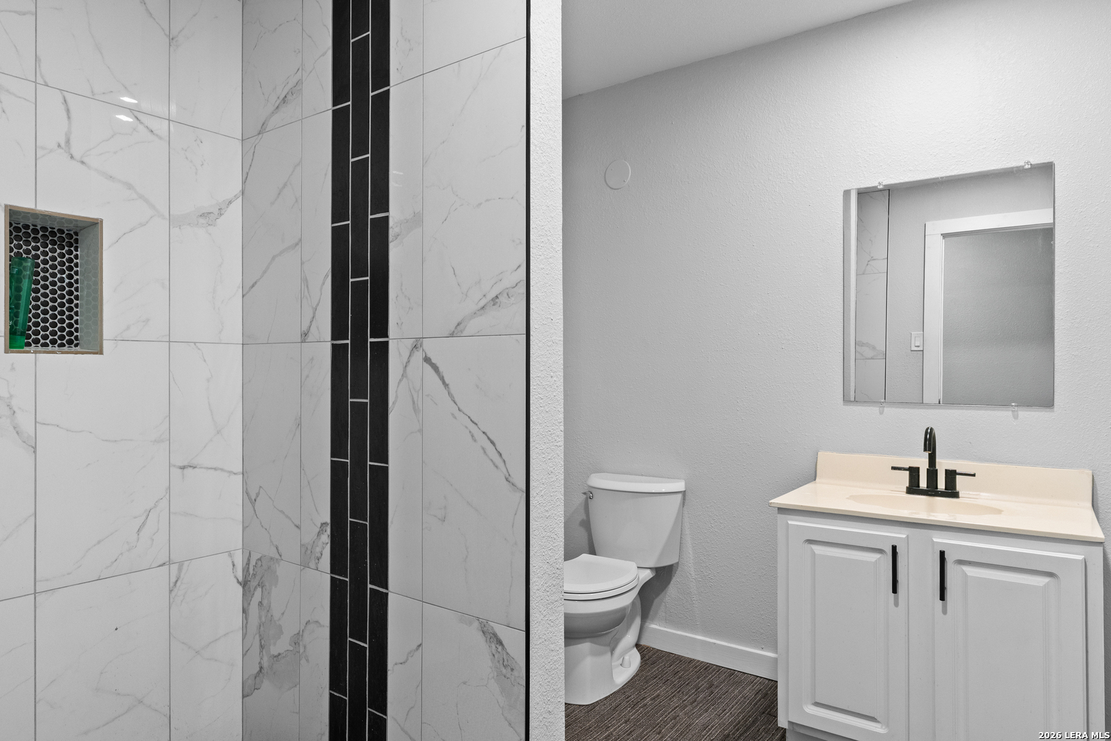 15285 South Skaggs Road Atascosa, TX 78002 - Photo 27 of 36 a bathroom with a toilet sink and shower