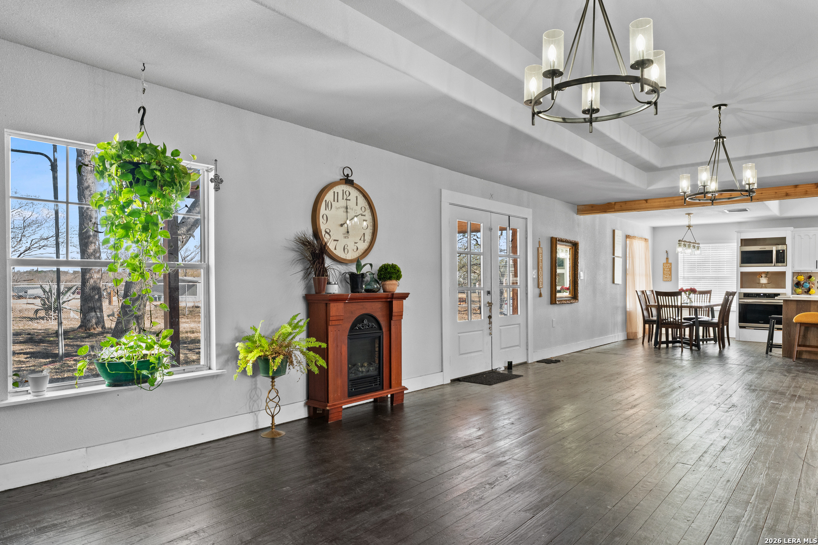 15285 South Skaggs Road Atascosa, TX 78002 - Photo 4 of 36 a view of a room with furniture and wooden floor