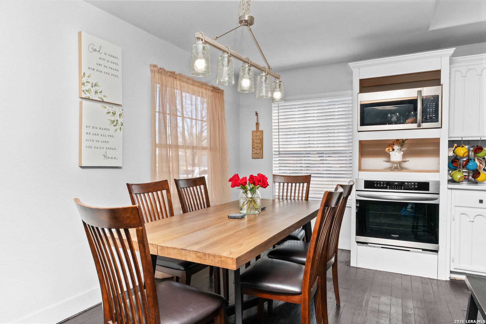 15285 South Skaggs Road Atascosa, TX 78002 - Photo 5 of 36 a view of a dining room with furniture and wooden floor