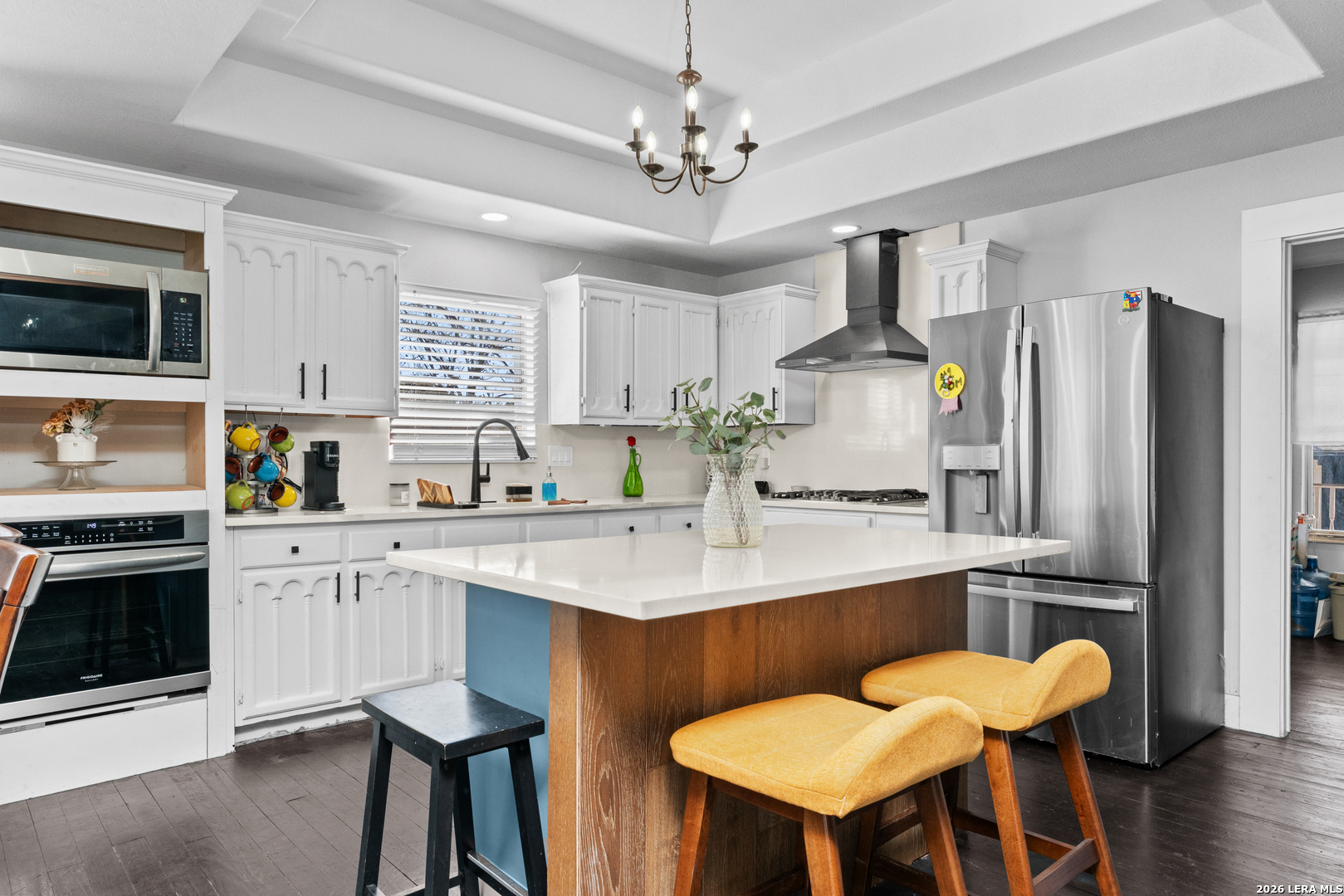 15285 South Skaggs Road Atascosa, TX 78002 - Photo 6 of 36 a kitchen with stainless steel appliances a sink stove and refrigerator