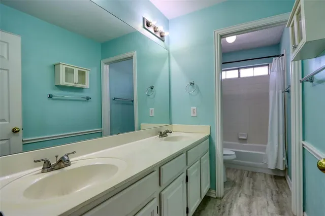 a bathroom with a sink double vanity and a mirror