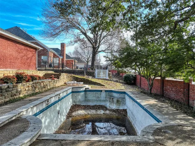a view of a swimming pool with a patio