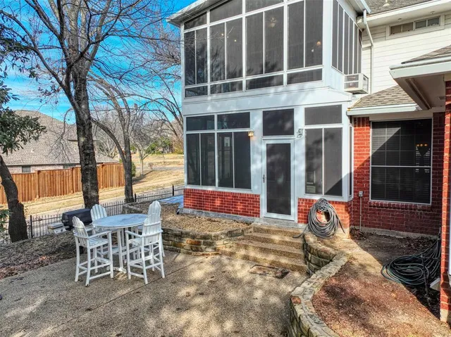 a view of a building with a table and chairs