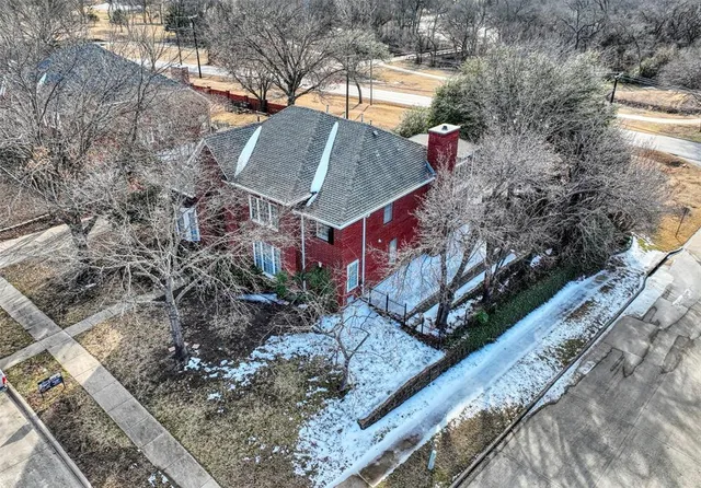 a view of a wooden house with a yard