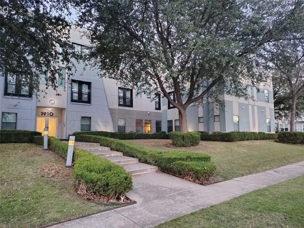 1910 Bennett Avenue Dallas, TX 75206 - Photo 3 of 9 a front view of a house with a yard and garage
