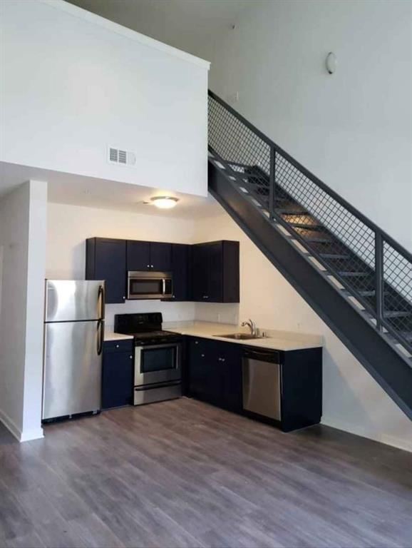 1910 Bennett Avenue Dallas, TX 75206 - Photo 5 of 9 a kitchen with stainless steel appliances a stove and cabinets