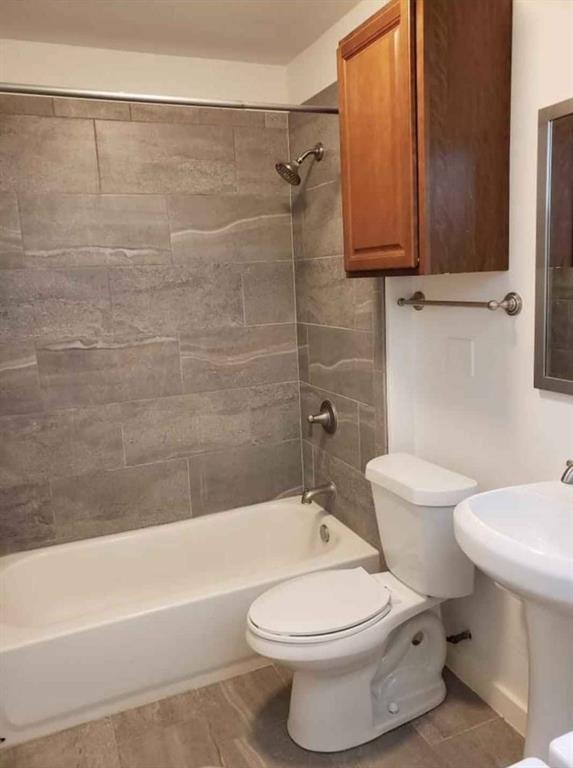 1910 Bennett Avenue Dallas, TX 75206 - Photo 8 of 9 a bathroom with a toilet a sink and bathtub