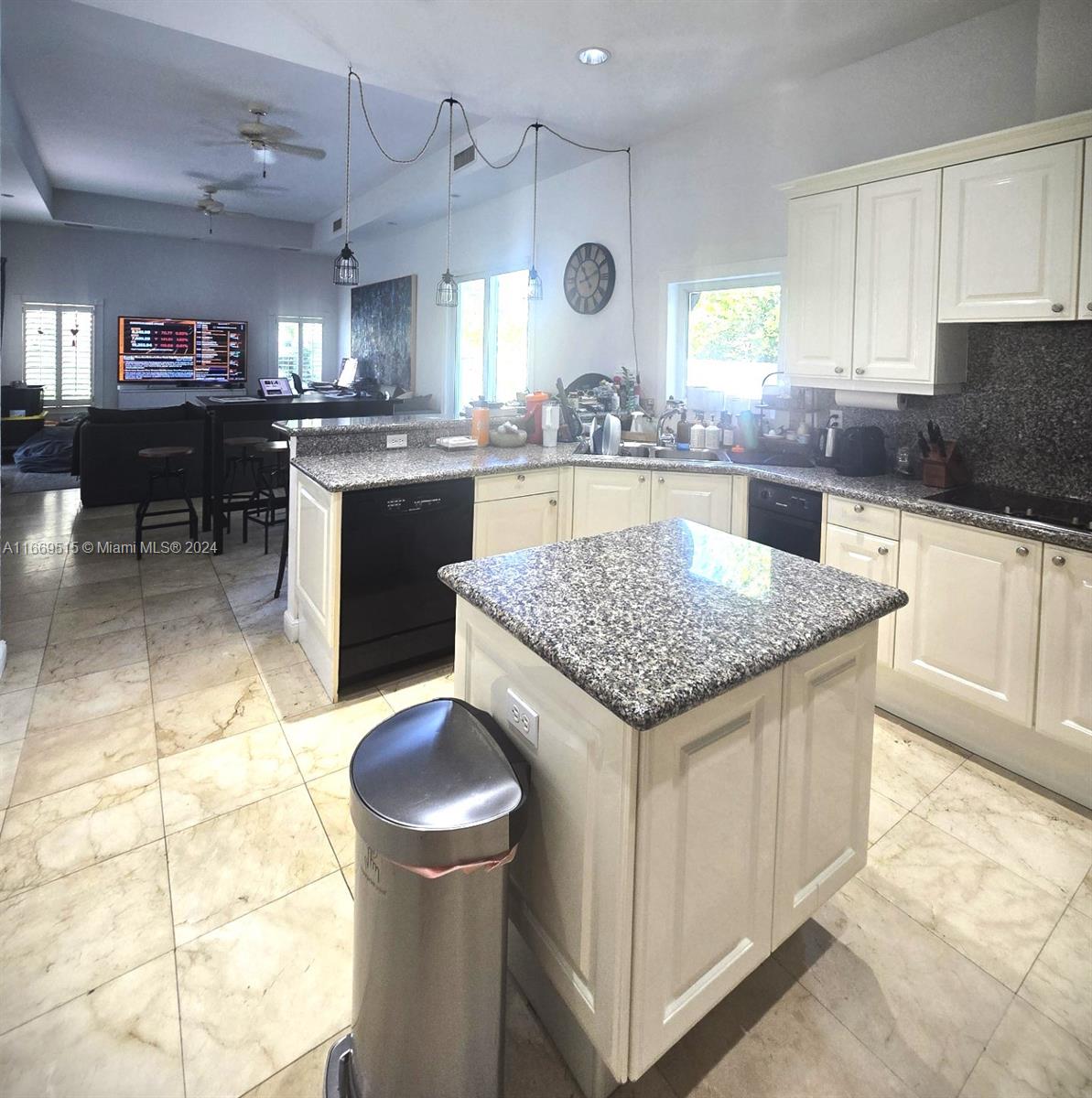 4 Turtle Walk, Unit 4 Key Biscayne, FL 33149 - Photo 16 of 29 a kitchen with a stove a sink cabinetry and a refrigerator