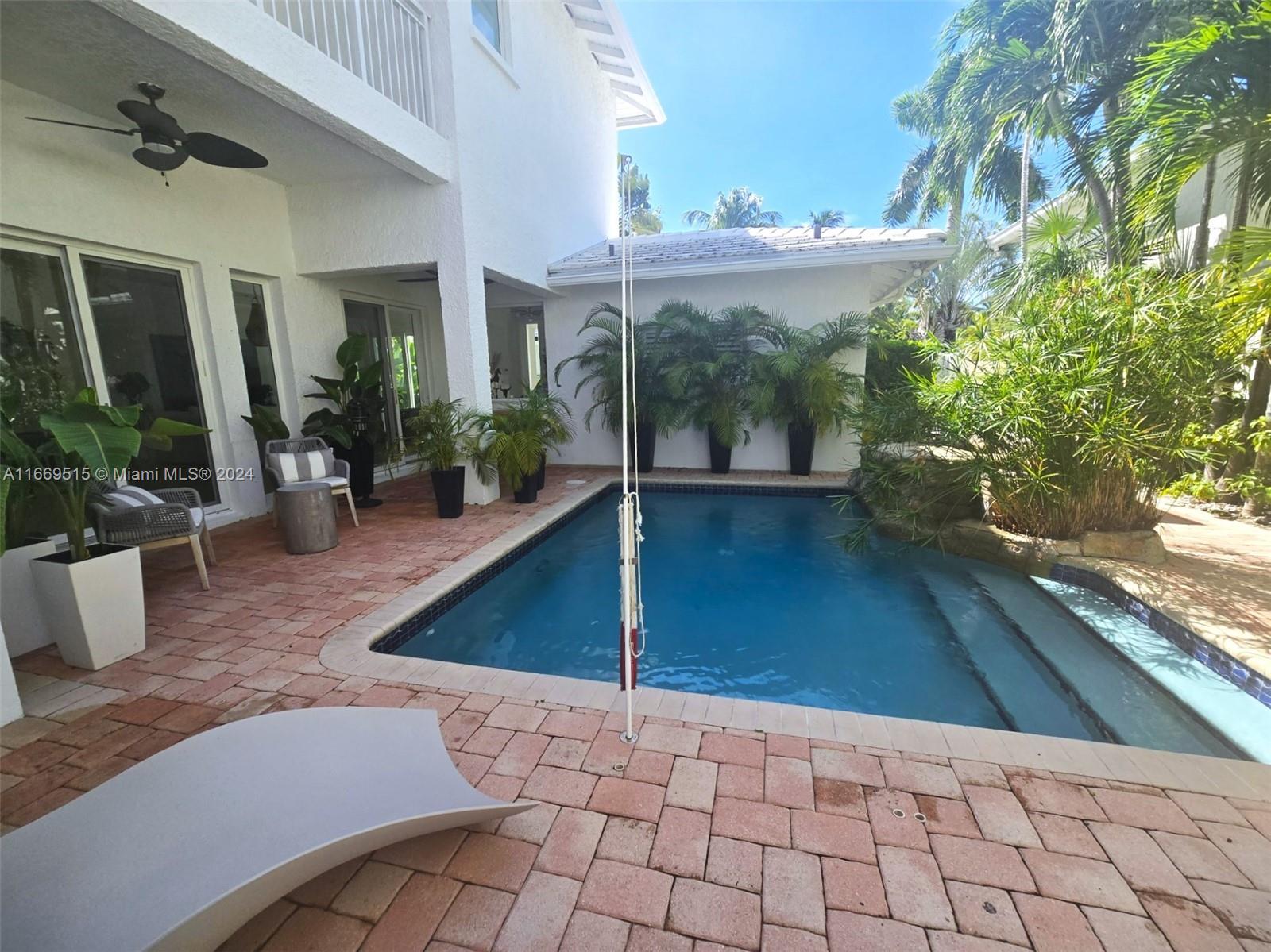 4 Turtle Walk, Unit 4 Key Biscayne, FL 33149 - Photo 19 of 29 a view of a terrace with seating space