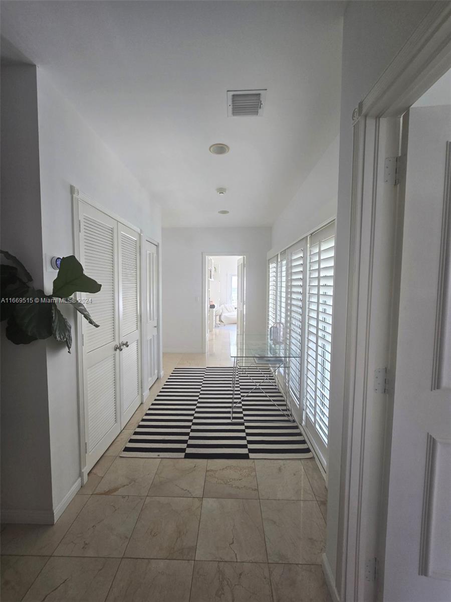 4 Turtle Walk, Unit 4 Key Biscayne, FL 33149 - Photo 24 of 29 a view of a room with windows