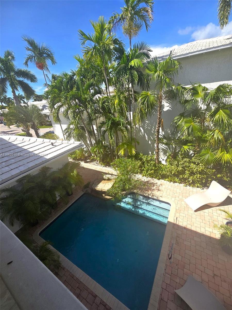 4 Turtle Walk, Unit 4 Key Biscayne, FL 33149 - Photo 29 of 29 a view of a lake from a balcony