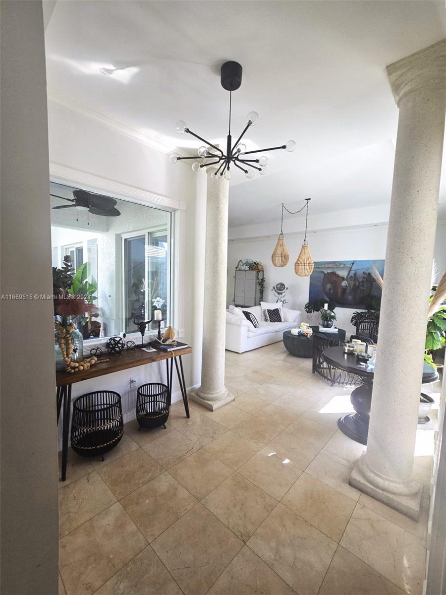 4 Turtle Walk, Unit 4 Key Biscayne, FL 33149 - Photo 7 of 29 a view of a livingroom with furniture and a ceiling fan