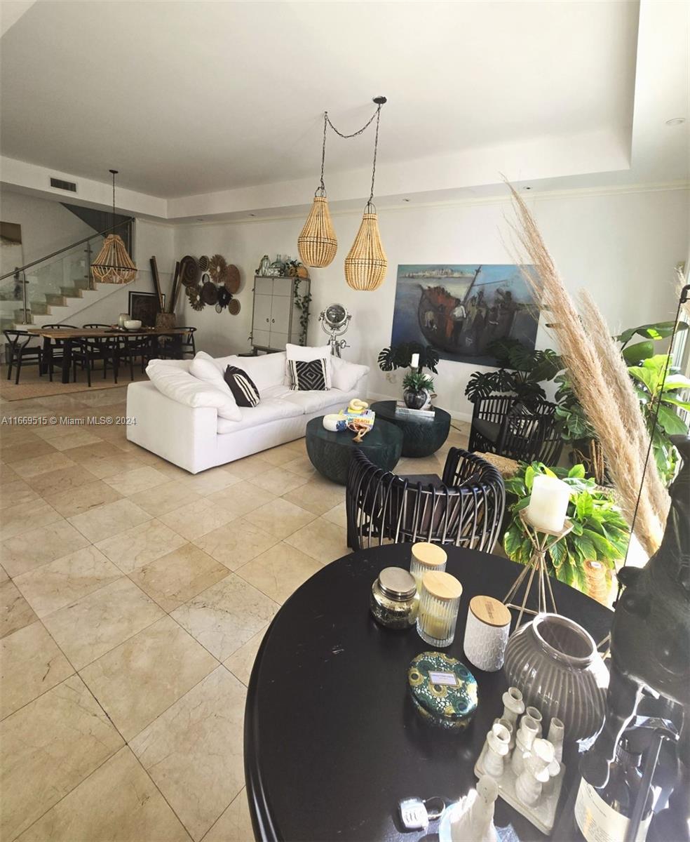 4 Turtle Walk, Unit 4 Key Biscayne, FL 33149 - Photo 8 of 29 a living room with furniture and a dining table